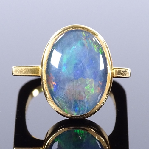 469 - A modernist 18ct gold black opal ring, square stylised shank, maker's marks GH, hallmarks London 197... 