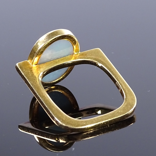 469 - A modernist 18ct gold black opal ring, square stylised shank, maker's marks GH, hallmarks London 197... 