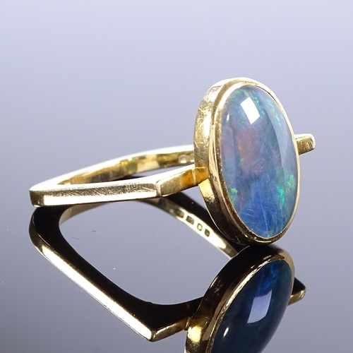 469 - A modernist 18ct gold black opal ring, square stylised shank, maker's marks GH, hallmarks London 197... 