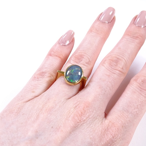 469 - A modernist 18ct gold black opal ring, square stylised shank, maker's marks GH, hallmarks London 197... 