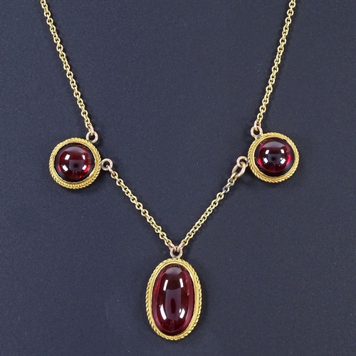 473 - A 19th century unmarked yellow metal 3-stone foil-back garnet collar necklace, rope twist borders, n... 