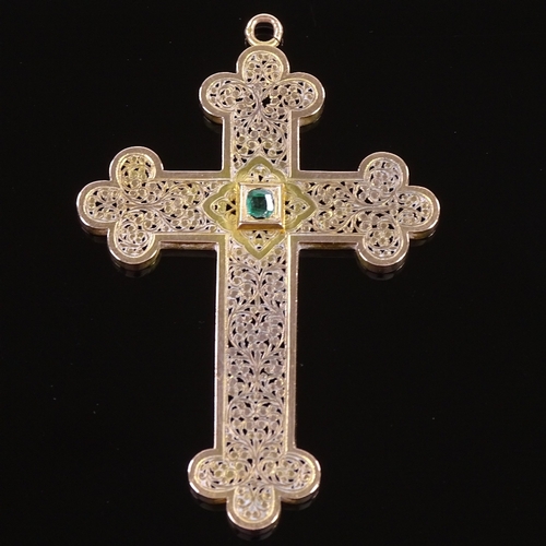 476 - A French? unmarked gold emerald crucifix pendant, pierced and engraved scrollwork decoration with ce... 