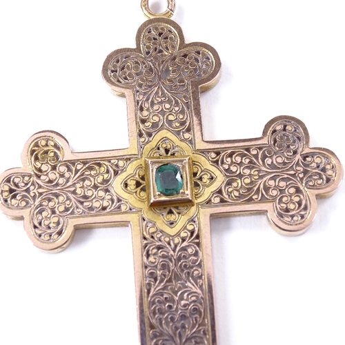 476 - A French? unmarked gold emerald crucifix pendant, pierced and engraved scrollwork decoration with ce... 