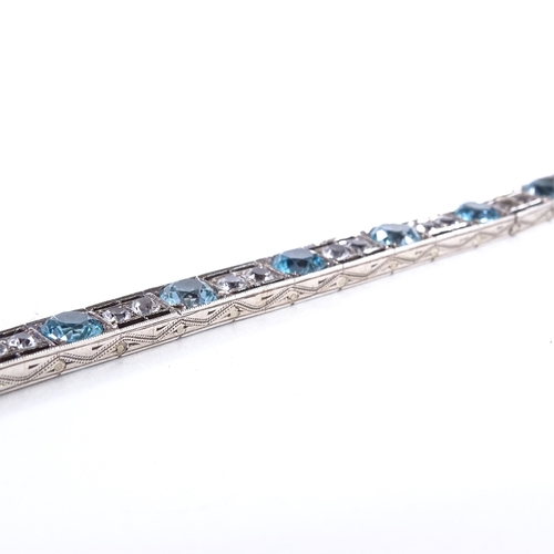 480 - An Art Deco unmarked silver blue topaz and white sapphire line panel bracelet, openwork settings wit... 