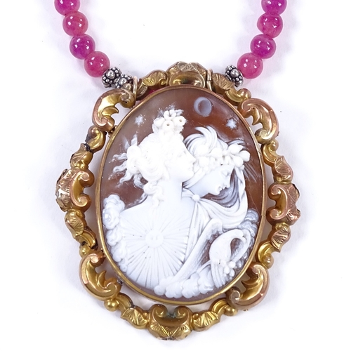 481 - A relief carved cameo shell panel and polished pink amethyst necklace, depicting female busts, in pi... 