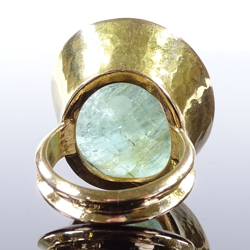 484 - A large handmade 18ct gold solitaire emerald dress ring, oval-cut emerald approx 50ct, in planished ... 