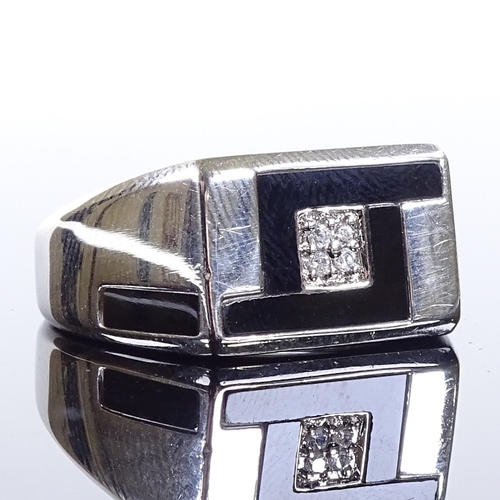 489 - A modern 9ct white gold diamond cluster onyx signet ring, onyx panel shoulders, maker's marks CLE, h... 