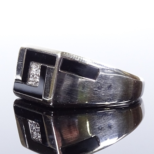 489 - A modern 9ct white gold diamond cluster onyx signet ring, onyx panel shoulders, maker's marks CLE, h... 