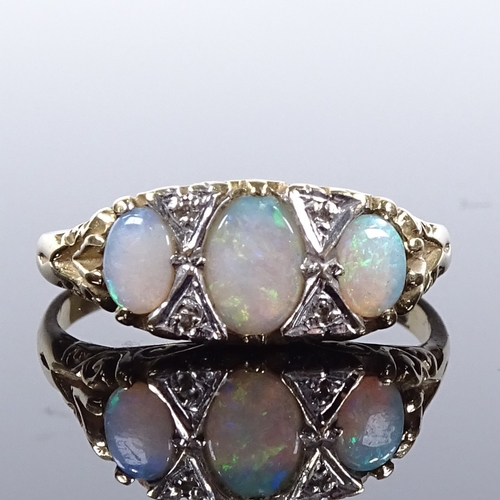 491 - A 9ct gold 7-stone opal and diamond half-hoop ring, scroll engraved bridge and shoulders, setting he... 