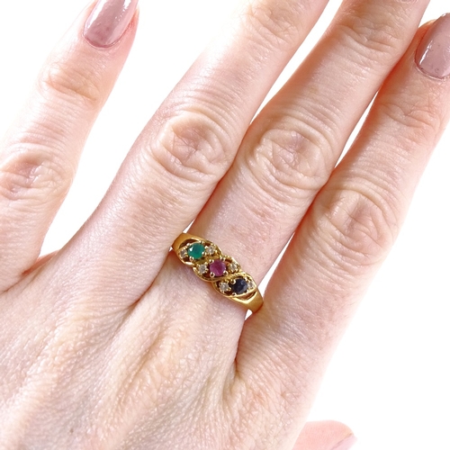 494 - An unmarked gold emerald ruby sapphire and paste dress ring, pierced settings and shoulders, setting... 