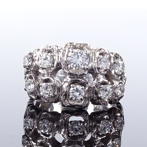 497 - A 14ct white gold diamond cluster abstract ring, openwork settings and shoulders, largest diamond ap... 