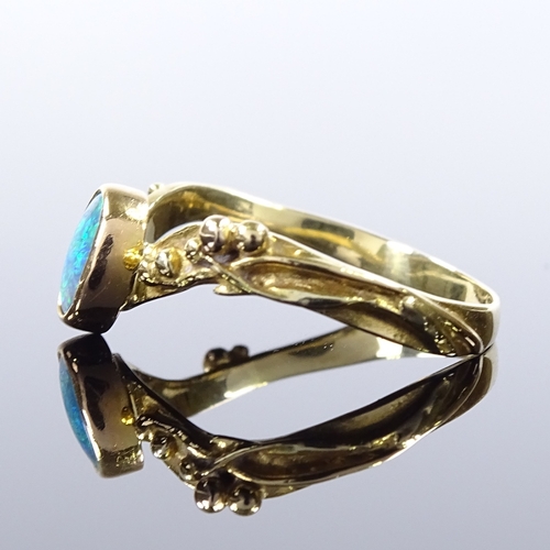 499 - An unmarked gold opal wishbone ring, relief berry shoulders, setting height 8.2mm, size T, 3.5g