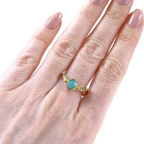 499 - An unmarked gold opal wishbone ring, relief berry shoulders, setting height 8.2mm, size T, 3.5g