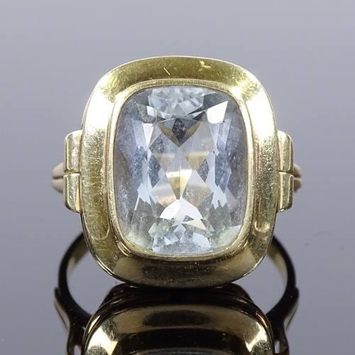 500 - A 14ct gold aquamarine dress ring, openwork bridge, setting height 19.4mm, size S, 6.6g