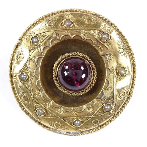 501 - An unmarked yellow metal foil back cabochon tourmaline and split-pearl circular brooch in rope twist... 