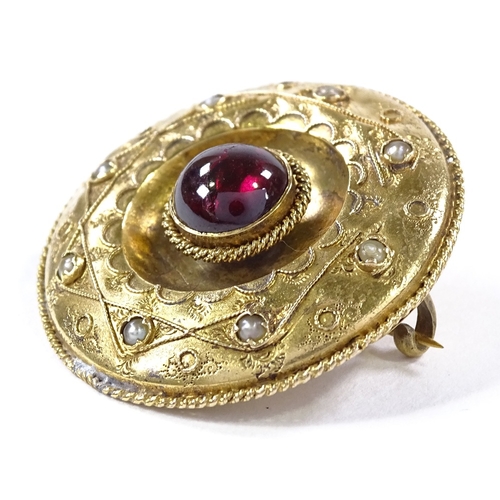 501 - An unmarked yellow metal foil back cabochon tourmaline and split-pearl circular brooch in rope twist... 