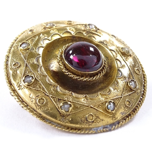 501 - An unmarked yellow metal foil back cabochon tourmaline and split-pearl circular brooch in rope twist... 