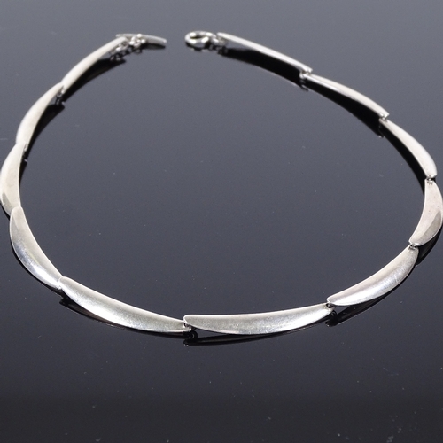 503 - A Theodor Skat-Rorden Danish sterling silver necklace, eleven plain curved form panels, maker's mark... 