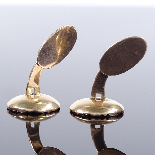 505 - A pair of Hugo Grun Danish unmarked gold and mother-of-pearl cufflinks, button panel design, maker's... 