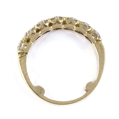 507 - An unmarked gold 7-stone diamond half hoop ring, total diamond content approx 1.4ct, each diamond ap... 