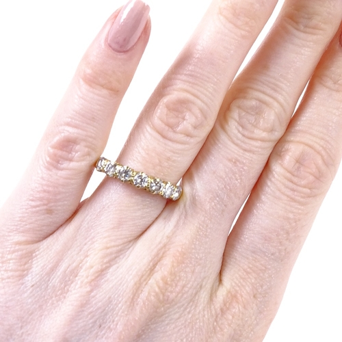 507 - An unmarked gold 7-stone diamond half hoop ring, total diamond content approx 1.4ct, each diamond ap... 