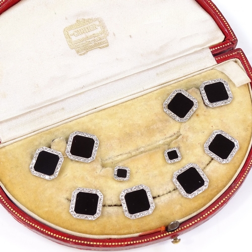 454 - An Art Deco unmarked white metal onyx and diamond dress set, comprising a pair of cufflinks, a pair ... 