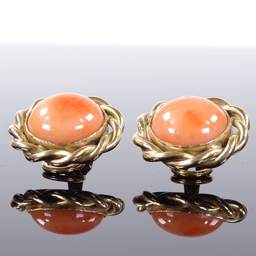 508 - A pair of 9ct gold cabochon coral earrings, with clip fittings and rope twist surround, earring diam... 