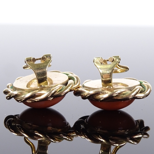 508 - A pair of 9ct gold cabochon coral earrings, with clip fittings and rope twist surround, earring diam... 