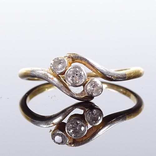 510 - An 18ct gold 3-stone diamond crossover ring, total diamond content approx 0.12ct, setting height 7.9... 