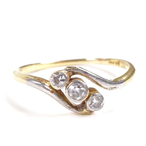 510 - An 18ct gold 3-stone diamond crossover ring, total diamond content approx 0.12ct, setting height 7.9... 