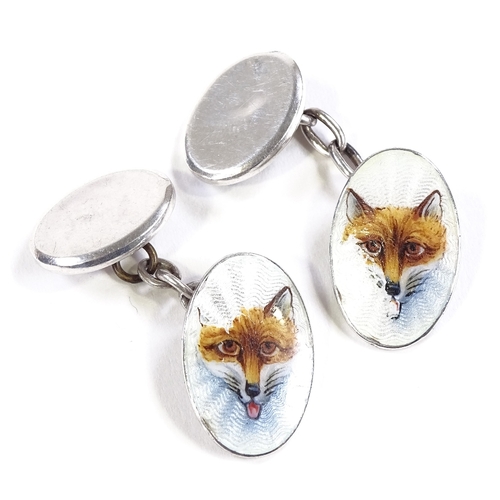 512 - A pair of Continental silver and enamel hunting fox head oval cufflinks, panel length 18.8mm, 6.5g