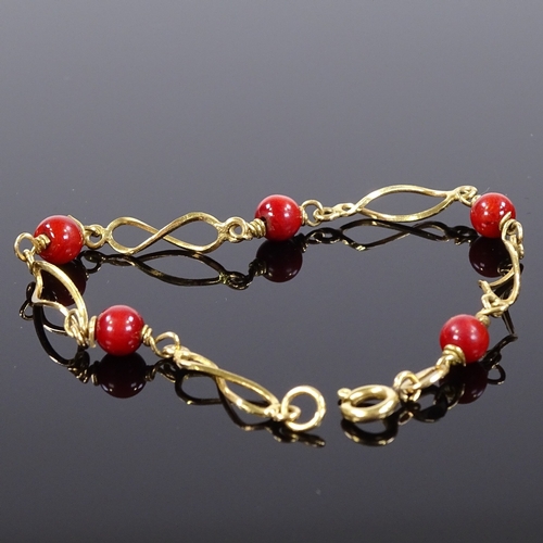 513 - An 18ct gold red bead bracelet, bracelet length 17.5cm, 4.6g