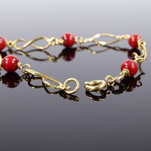 513 - An 18ct gold red bead bracelet, bracelet length 17.5cm, 4.6g