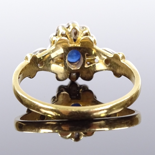 514 - An 18ct gold sapphire and diamond cluster ring, with diamond set foliate shoulders, setting height 1... 