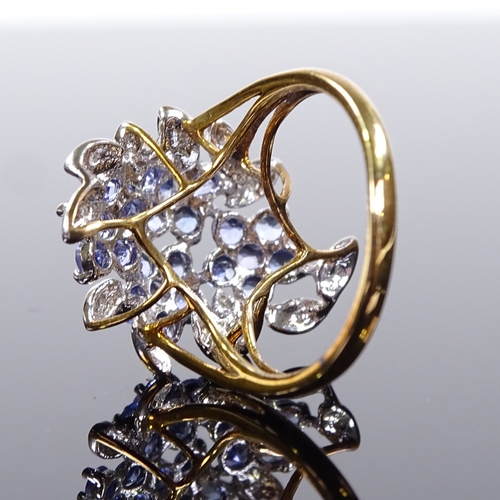 515 - A 9ct gold blue stone and diamond cluster cocktail ring, with openwork bridge, setting height 22.3mm... 