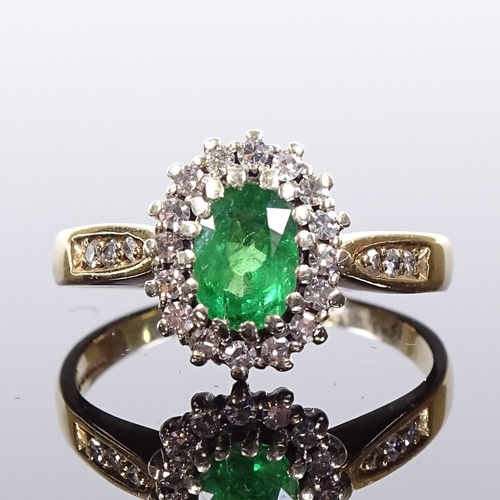 517 - A 9ct gold emerald and diamond cluster ring, diamond set shoulders, maker's marks DS & Co, hallmarks... 