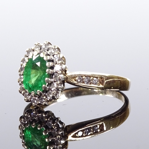 517 - A 9ct gold emerald and diamond cluster ring, diamond set shoulders, maker's marks DS & Co, hallmarks... 