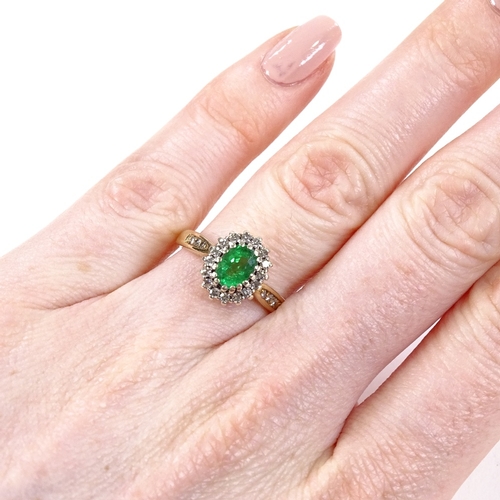 517 - A 9ct gold emerald and diamond cluster ring, diamond set shoulders, maker's marks DS & Co, hallmarks... 