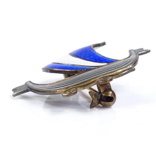 524 - An Aksel Holmsen Norwegian sterling silver gilt and coloured enamel viking ship brooch, height 30.8m... 