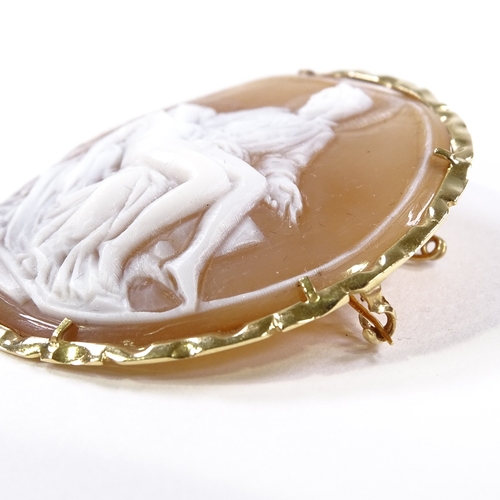 535 - A relief carved circular cameo shell panel pendant/brooch, depicting Madonna and Christ, 14ct frame,... 