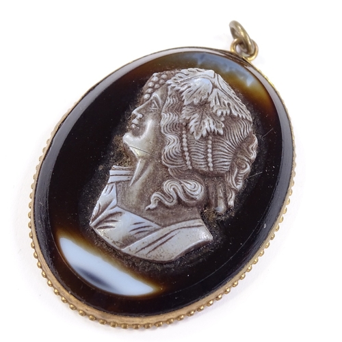 537 - A relief carved cameo agate panel pendant, depicting female bust, in gilt-metal frame, pendant heigh... 