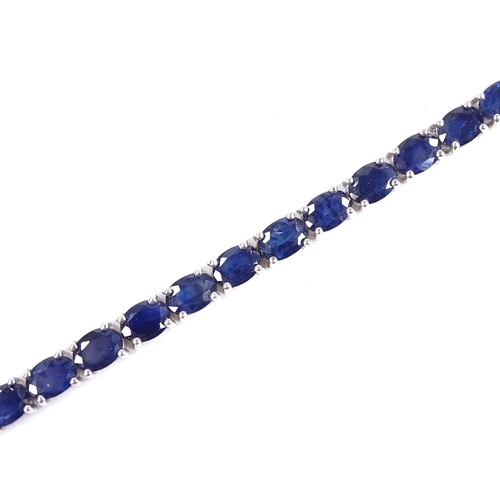 538 - A sterling silver sapphire line bracelet, total oval-cut sapphire content approx 19ct, bracelet leng... 