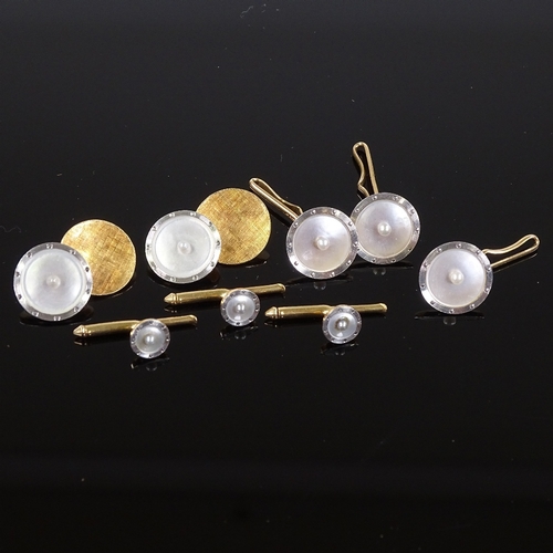 539 - A 14ct gold pearl and mother-of-pearl dress set, including a pair of cufflinks, 3 buttons and 3 dres... 