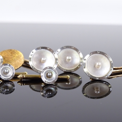 539 - A 14ct gold pearl and mother-of-pearl dress set, including a pair of cufflinks, 3 buttons and 3 dres... 