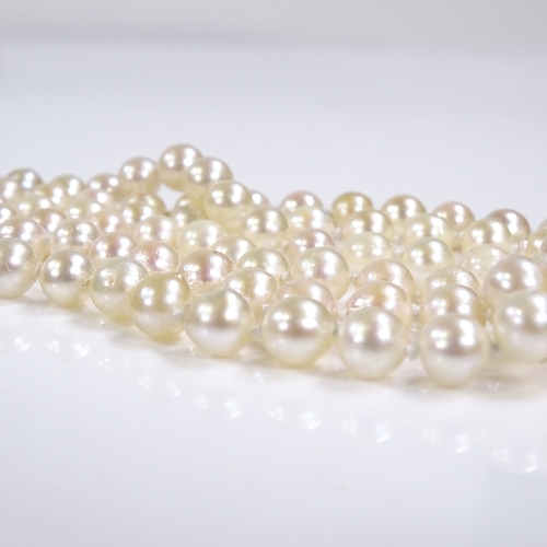 541 - A triple strand cultured pearl collar necklace, on 9ct foliate engraved clasp, necklace length 13