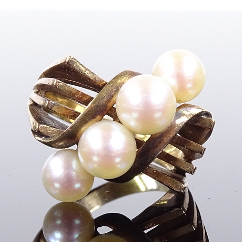 543 - An Art Deco style 14ct gold pearl dress ring, openwork stylised shoulders, possibly Mikimoto, settin... 