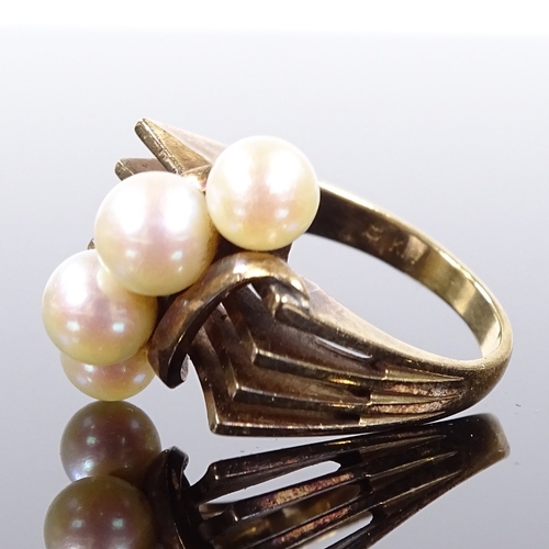 543 - An Art Deco style 14ct gold pearl dress ring, openwork stylised shoulders, possibly Mikimoto, settin... 