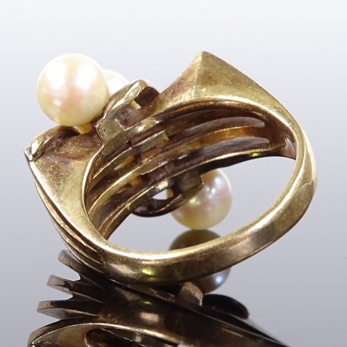 543 - An Art Deco style 14ct gold pearl dress ring, openwork stylised shoulders, possibly Mikimoto, settin... 