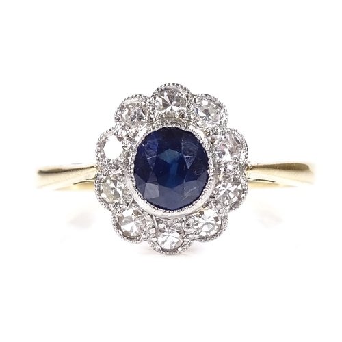 555 - An 18ct gold sapphire and diamond cluster flowerhead ring, setting height 10.8mm, size N, 2.7g