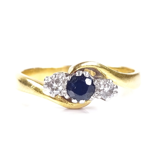 557 - A 22ct gold 3-stone sapphire and diamond crossover ring, platinum-topped settings, hallmarks Birming... 